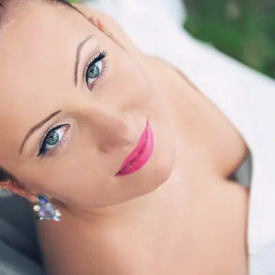 Wedding makeup — fresh look with bold pink lip and blue-green eyes