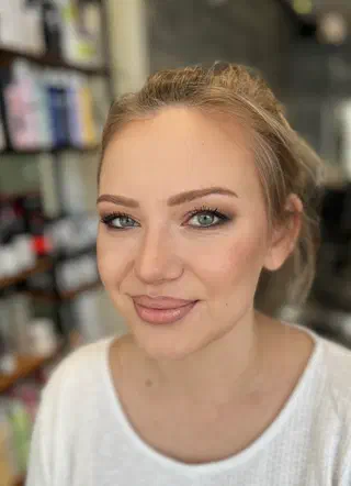 Wedding makeup — natural glowing look with warm smile and nude tones
