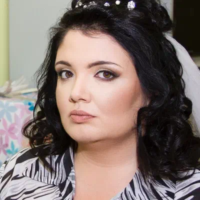 Wedding makeup — ceremonial look with crystal crown and dark curls